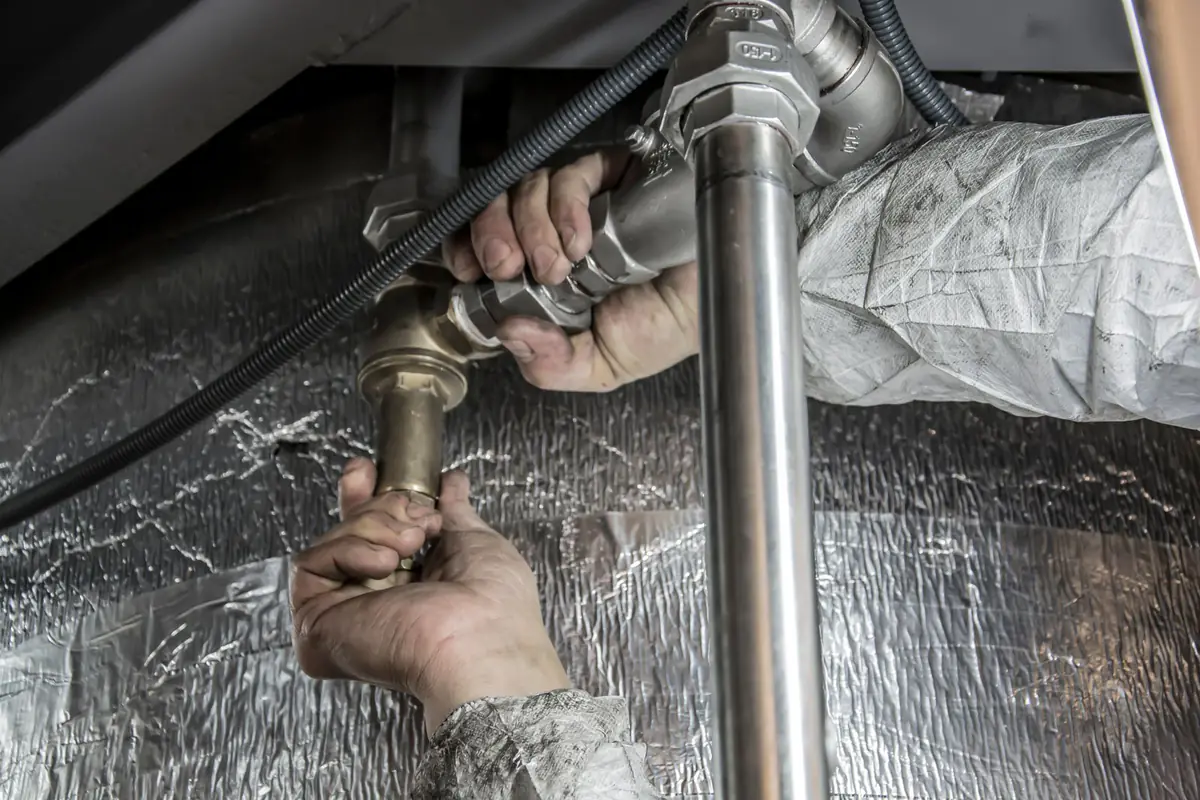 A plumber fitting copper pipework